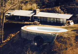 Hillside house with satellite dish